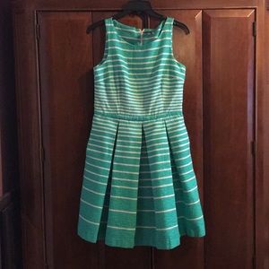 Green fitted to the waist dress